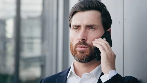 Portrait serious man talking on mobile phone answering business call successful Stock Footage 219822882