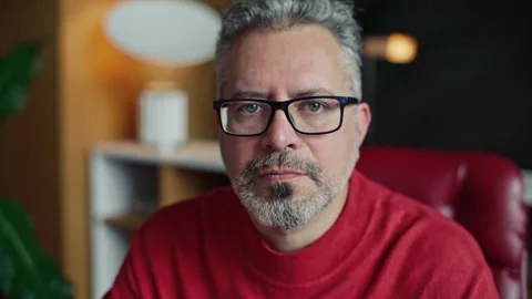 Portrait of Serious Middle-Aged Man Wearing Glasses in Therapy Office Stock Footage 317734055