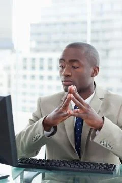 Portrait of a serious office worker using a computer Stock Photos