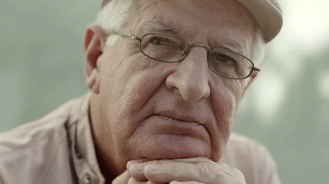 Portrait of serious old man with hat and eyeglasses Video stock 11132301