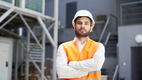 Portrait of serious professional engineer wearing safety helmet and vest stand Stock Footage 314719986
