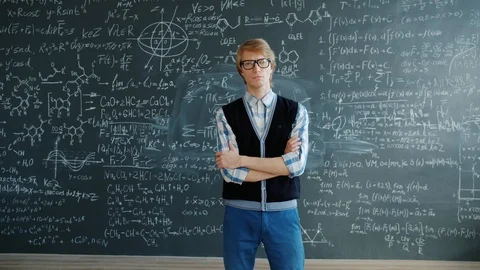 Portrait of serious student standing in class with arms crossed looking at Stock Footage 125020491