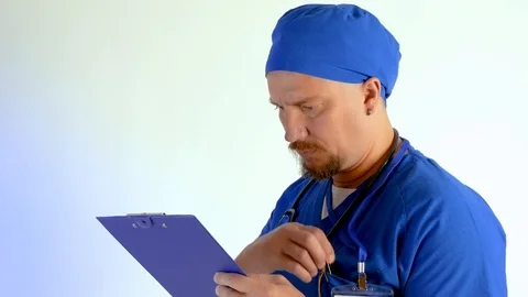 Portrait of serious surgeon with stethoscope that posing on camera  Stock Footage 103617672