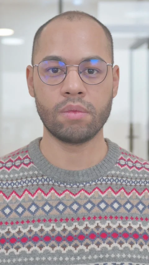 Portrait of Serious Young Hispanic Man, vertical video Video stock 325567495