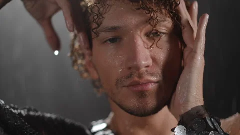  Portrait set against a rainy backdrop with dramatic lighting contrasts Stock Footage 313633548