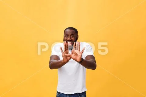 Portrait shock and annoyed displeased young man raising hands up to say no stop Stock Photos