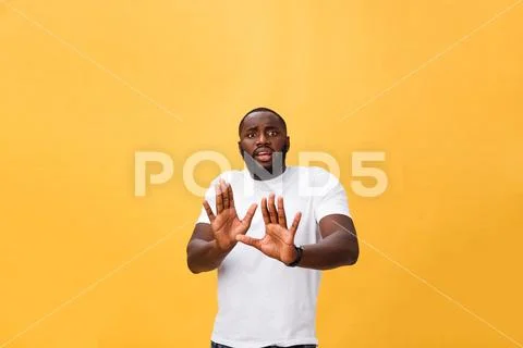 Portrait shock and annoyed displeased young man raising hands up to say no stop Stock Photos