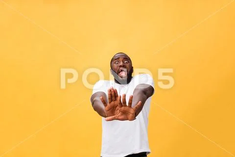 Portrait shock and annoyed displeased young man raising hands up to say no stop Stock Photos