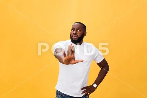 Portrait shock and annoyed displeased young man raising hands up to say no stop Stock Photos