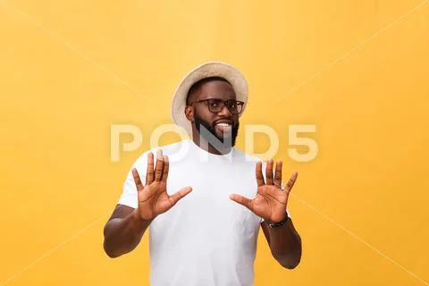 Portrait shock and annoyed displeased young man raising hands up to say no stop Stock Photos