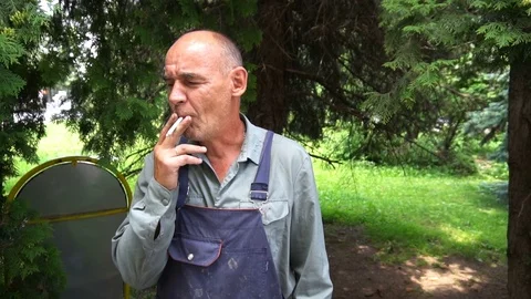 Portrait of a shoemaker Smoking on break Video stock 77882635