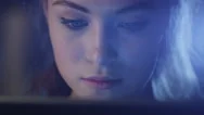 Portrait Shot Of A Beautiful Young Girl Looking A Working Tablet In The Dark Stock Footage