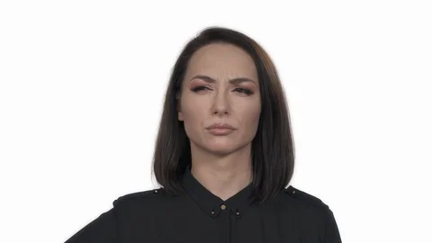 Portrait shot of a puzzled young pretty woman demonstrating doubting emotion. Stock Footage 125181799