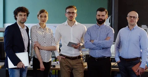 Portrait shot of smiled multi-ethnical business team posing in the modern office Stock Footage 82444658