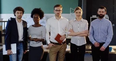 Portrait shot of young multi-ethnical business team standing in the modern Stock Footage 82444687