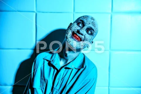 A portrait of a sick scientist after a failed experiment in the blue light. d Stock Photos
