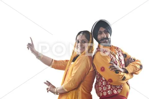 Portrait of Sikh couple standing back to back Stock Photos
