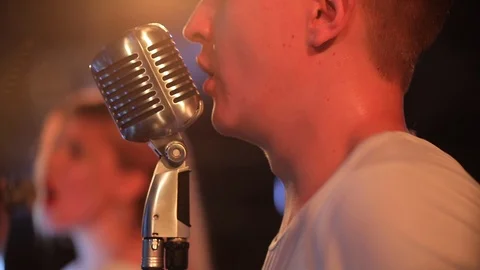 Portrait of singer with retro microphone Stock Footage 105137596