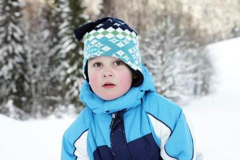 Portrait small boy in winter on mountains Stock Photos