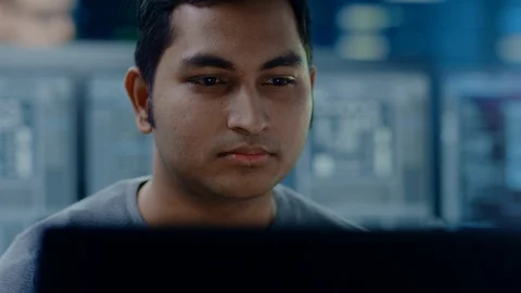 Portrait of a Smart and Handsome IT Specialist Working on a Personal Computer. Stock Footage 103517121