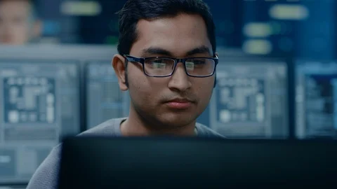 Portrait of a Smart and Handsome IT Specialist Working on a Personal Computer. Stock Footage 103517669