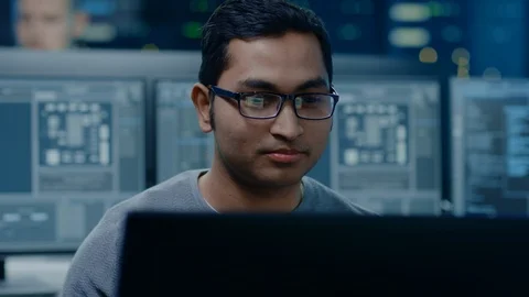 Portrait of a Smart and Handsome Software Developer Wearing Glasses Working Stock Footage 103517829