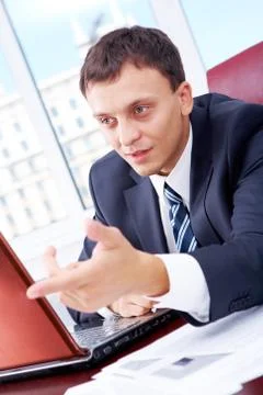Portrait of smart businessman during interaction at workplace Stock Photos