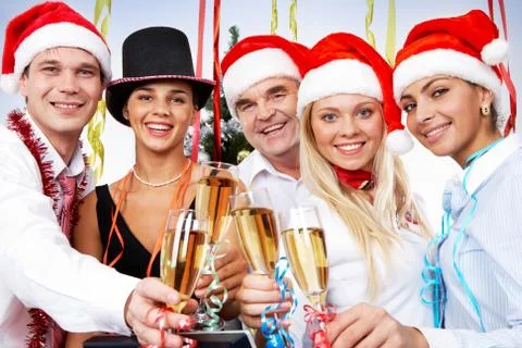 Portrait of smart colleagues with flutes of champagne celebrating christmas Stock Photos