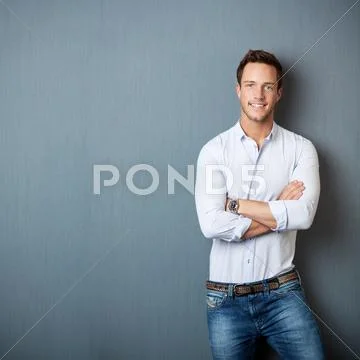 Portrait Of Smart Man Against Gray Background