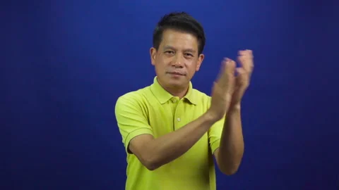 Portrait of smart middle-aged asian man applauding to camera Stock Footage 219469233
