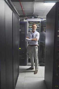 Portrait, smile or engineer in server room with arms crossed, pride or Stock Photos
