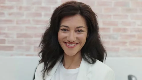 Portrait of a smiling 45 year old Spanish woman looking at camera. Entreprene Stock Footage 155987363