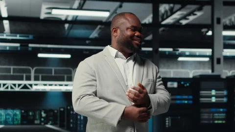 Portrait of smiling admin doing yearly checkup on data center electronics Stock Footage 311897184