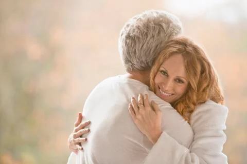 Portrait smiling affectionate couple hugging Stock Photos