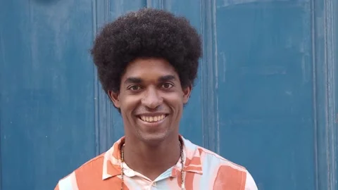 Portrait of a smiling afro young man looking at camera Stock Footage 159449604