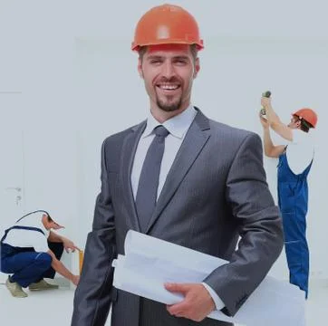 Portrait of a smiling architect. against the backdrop   team Stock Photos