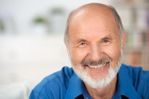 Portrait of a smiling attractive senior man Stock Photos
