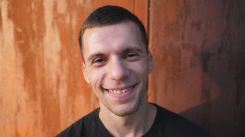 Portrait of smiling bearded man looking into camera with positive emotions face Stock Footage 120073676