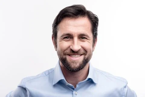 Portrait of smiling bearded middle-aged man Stock Photos