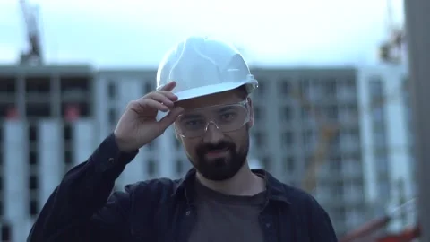 Portrait of Smiling bearded Professional Architect / Worker Wearing Goggles Stock Footage 138934309