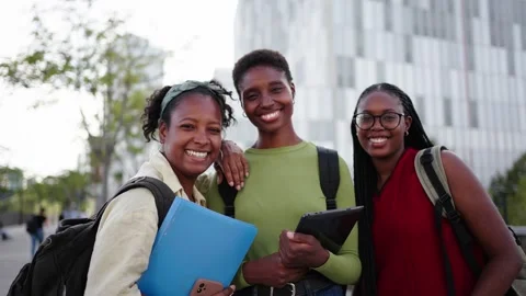 Portrait of smiling beautiful group of young black women students posing Stock Footage 270948522