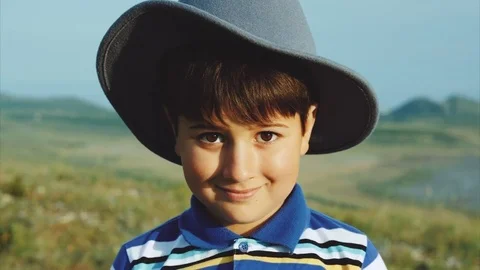 Portrait of a smiling boy in a felt hat Stock-Footage 79388594