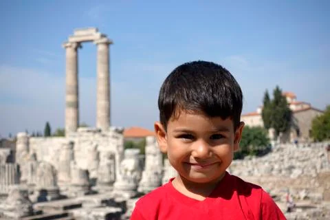 Portrait of smiling boy in the temple of Apollo. Stock Photos