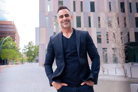 Portrait of smiling businessman looking at camera outdoors Stock Photos