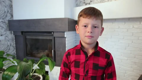 Portrait of a smiling casual little boy. Adorable young lad looking at camera Vídeo Stock 147583553