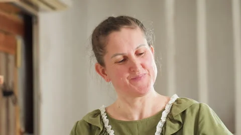 Portrait of Smiling Chef Demonstrating Sticky Dough in Cozy Kitchen Scene Stock Footage 307123936