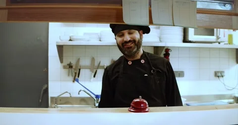 Portrait of a smiling chef in a restaurant looking at the camera Stock Footage 163172034
