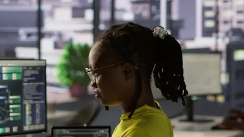 Portrait of smiling computer scientist at work doing software debugging using PC Stock Footage 318159389
