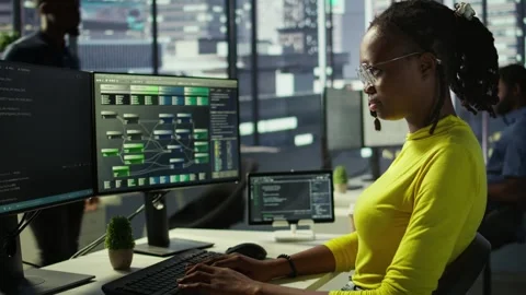 Portrait of smiling computer scientist at work doing software debugging using PC Stock Footage 318160793