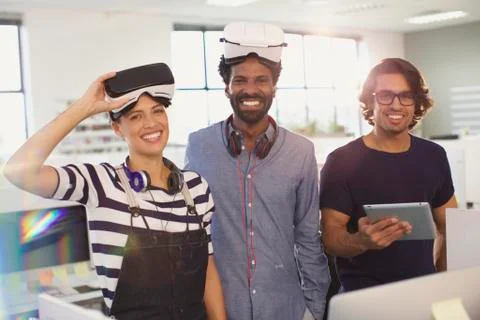 Portrait smiling, confident computer programmers testing virtual reality Stock-Fotos